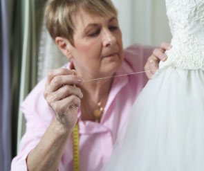 woman altering wedding dress